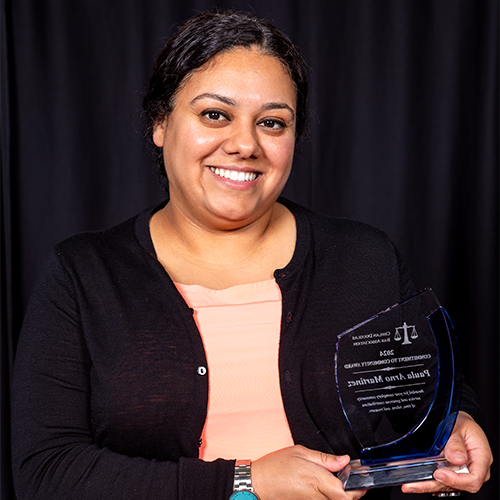 Paula Arno Martinez holding award